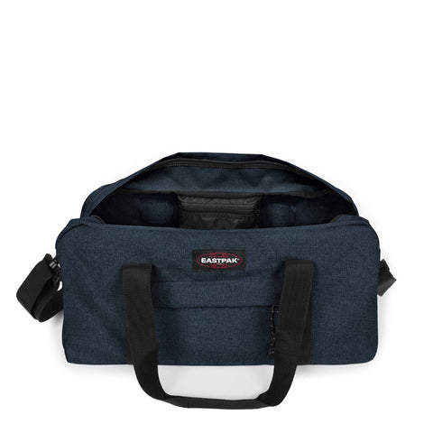 Sac de voyage Eastpak Stand Cabin Triple Denim — detail poignee et roulettes